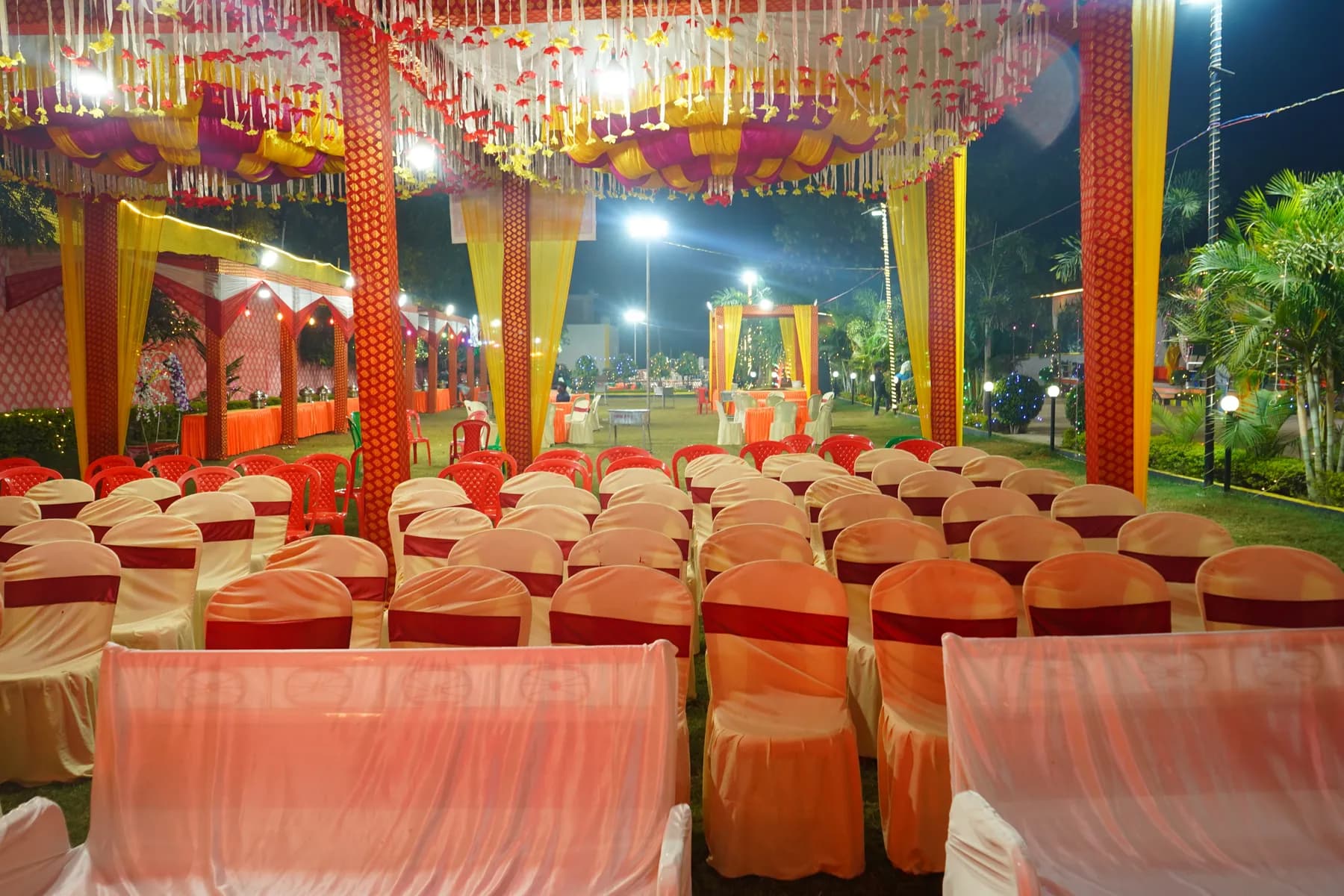 Mandap with guest seating under a decorated pandal