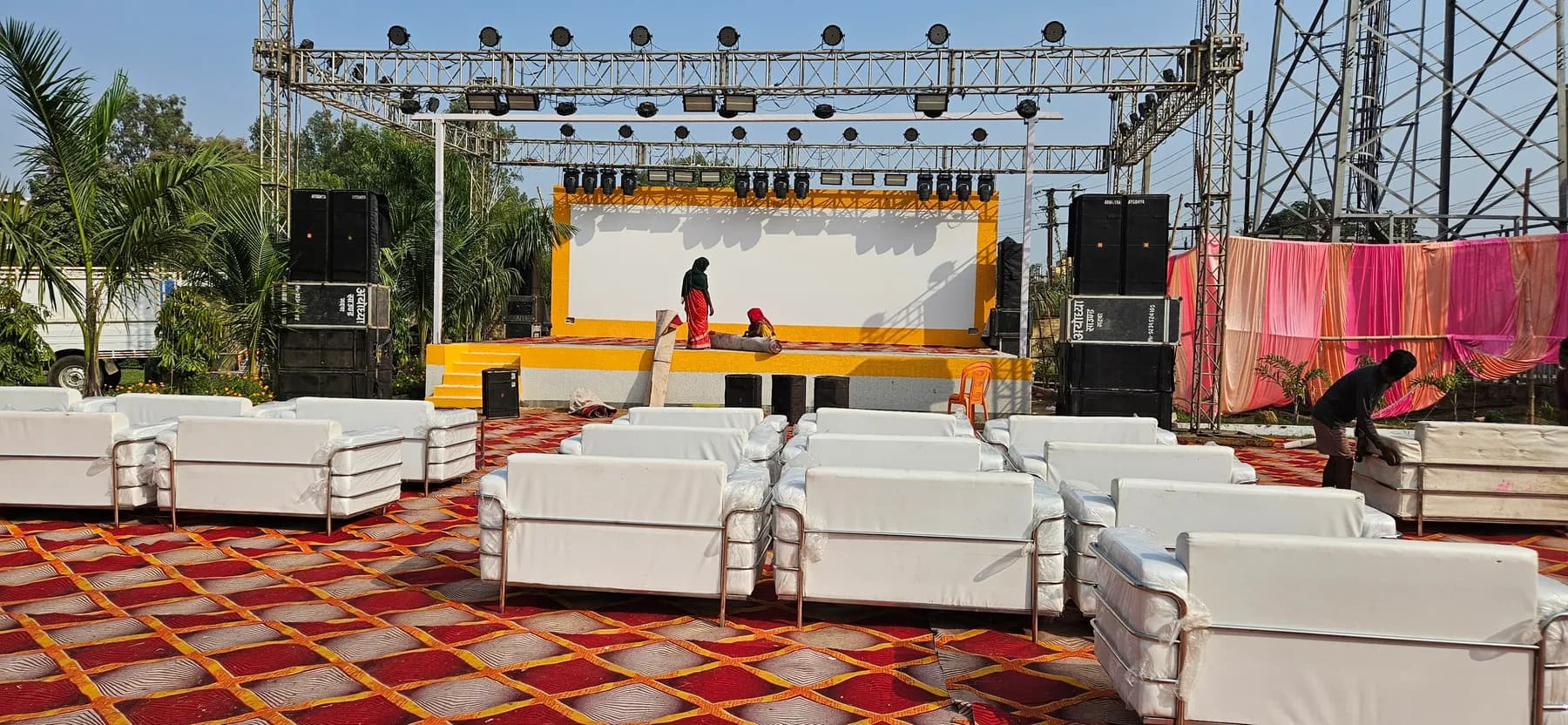 Outdoor lawn event stage and sofa seating at Bandhan Marriage Hall